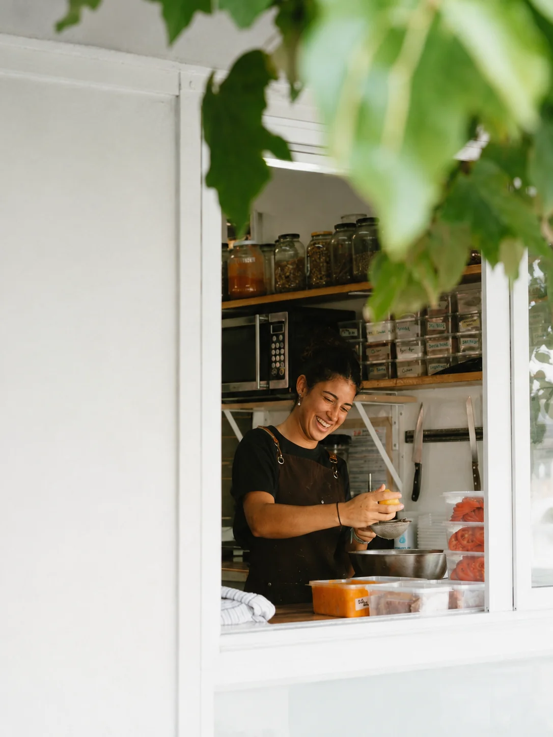 A team member at Eddie's kitchen service window